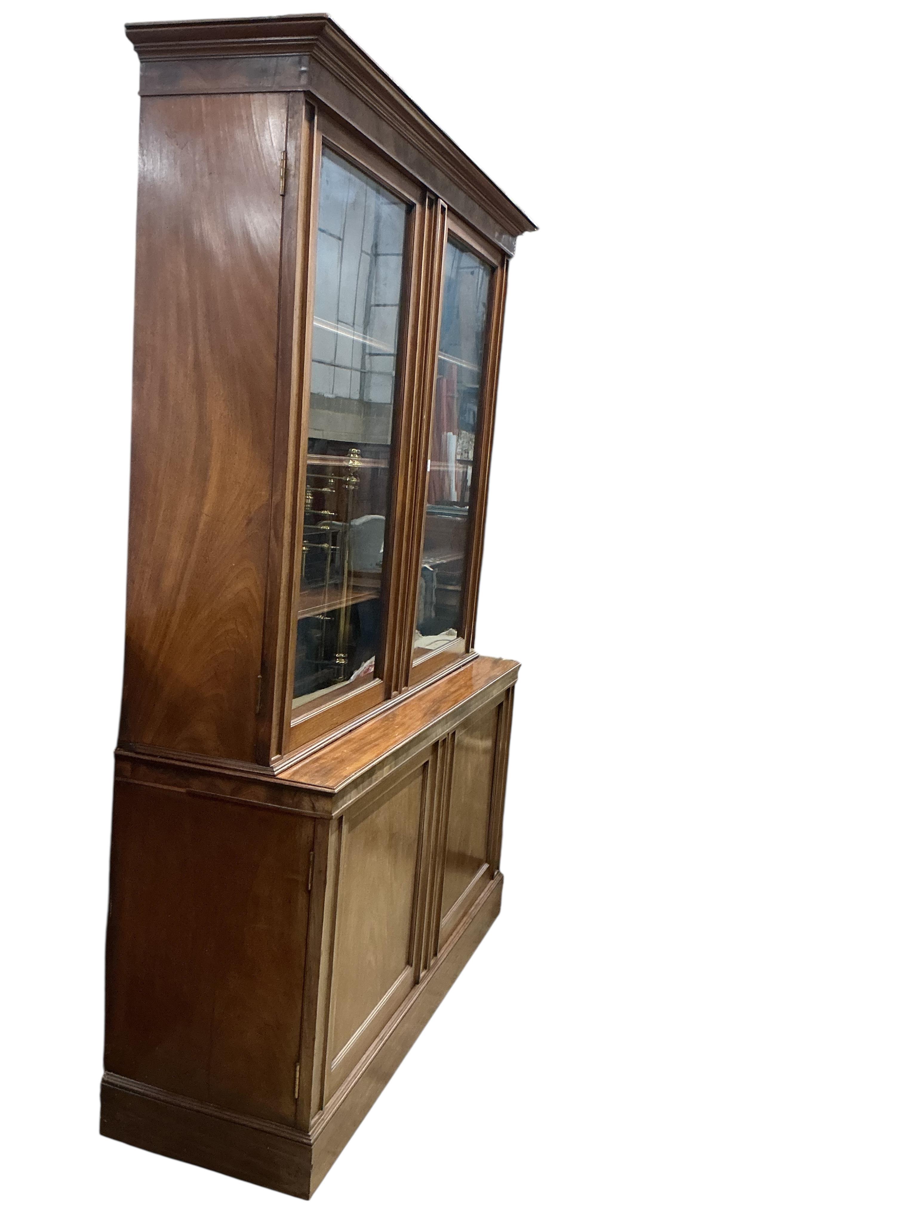 A mid Victorian mahogany library bookcase, width 154cm, depth 52cm, height 235cm